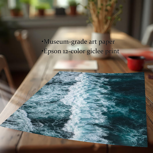 Close-up of an unframed ocean wave print on a wooden table, highlighting the print quality and materials: Museum-grade art paper and Epson 12-color giclee print