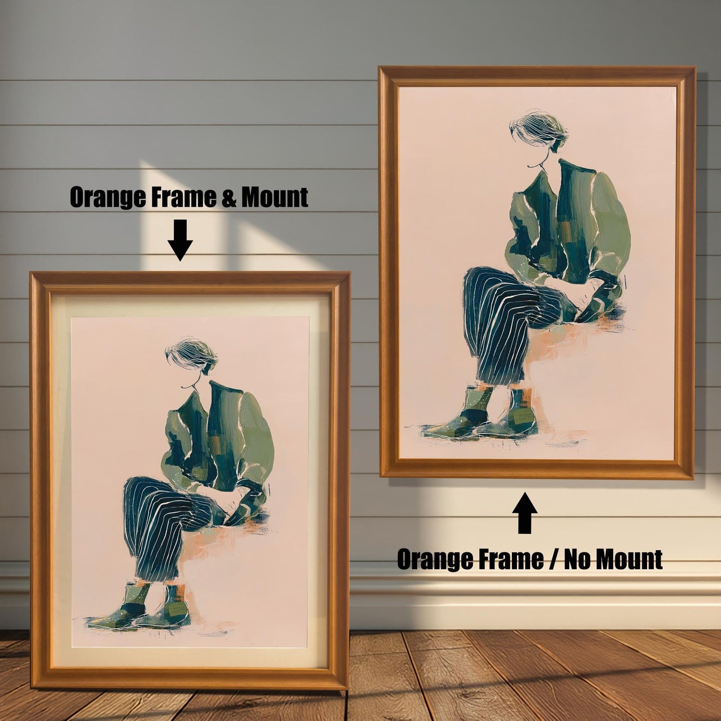 Comparison of the art print in an Orange wood frame: Left is "Orange Frame & Mount" with a light matting, and Right is "Orange Frame / No Mount" without matting. The artwork features a figure seated in green and dark striped clothing on a light pink background.
