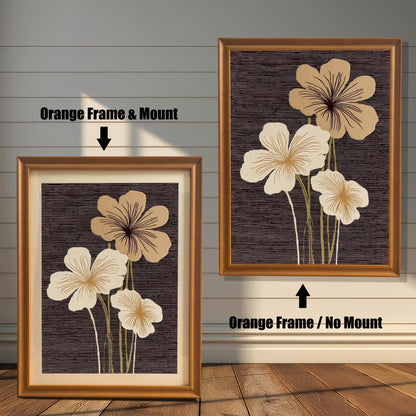 Two framed abstract floral art prints against a white wood panel wall. The print on the left has an Orange Frame & Mount (matting). The print on the right has an Orange Frame / No Mount.