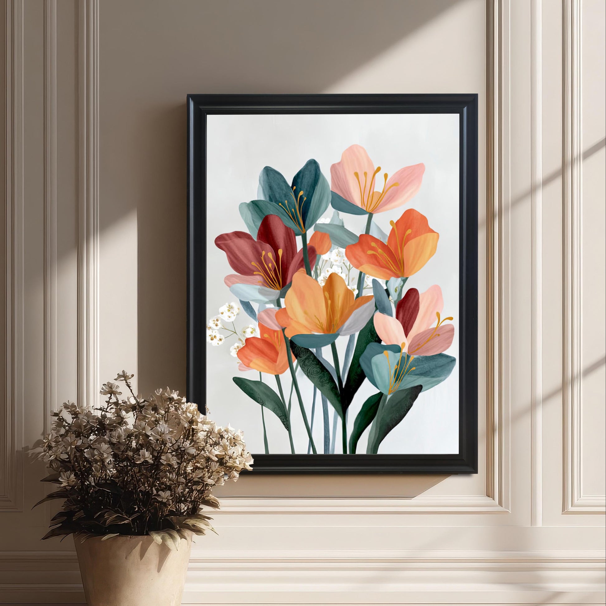 Framed abstract floral art print in a black frame leaning on the floor against an elegant white wainscoted wall, next to a decorative pot of dried flowers.