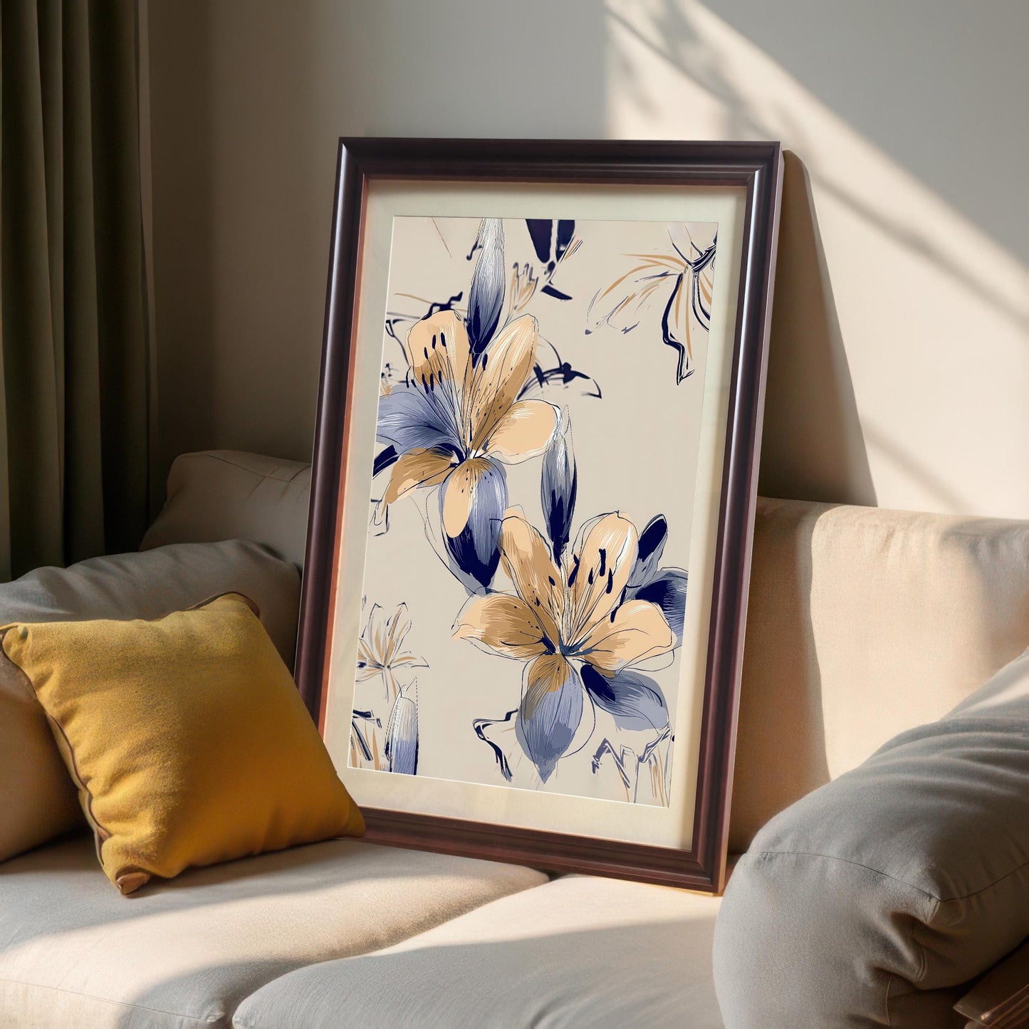 Framed print of the Navy Blue and Peach Floral artwork in a coffee (dark brown) wood frame with a mat/mount, resting on a beige sofa next to a yellow pillow.