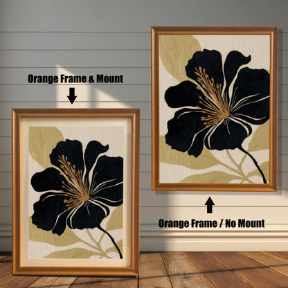 A comparison of two black and gold floral prints against a white wood-paneled wall: one in an Orange Frame & Mount (matting), and the other in an Orange Frame / No Mount (no matting).