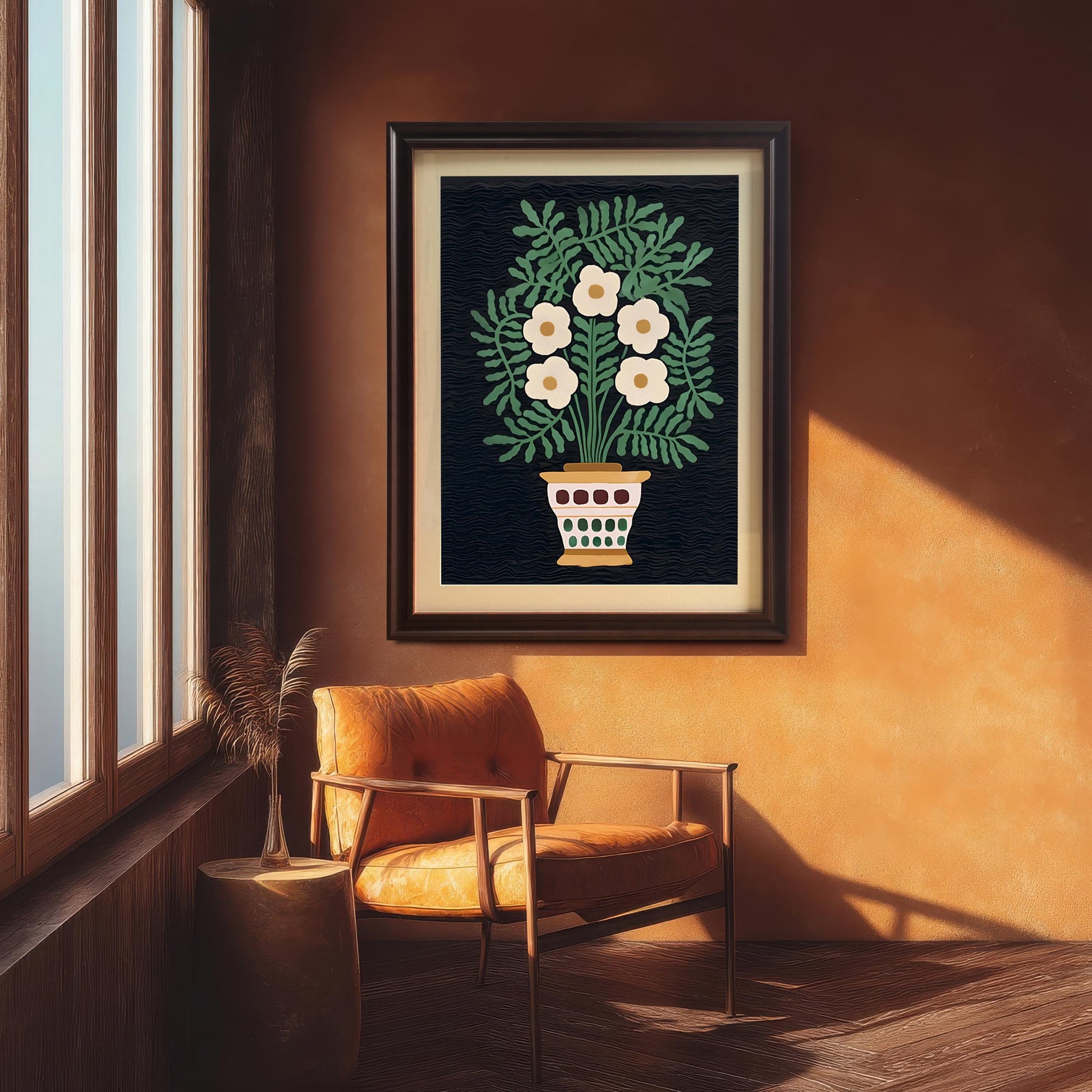 The folk art floral print hangs on a dark orange-brown textured wall, framed in a Dark Coffee Frame. The art is situated above a wooden chair with an orange leather cushion next to a large window, showing a cozy, autumnal aesthetic.