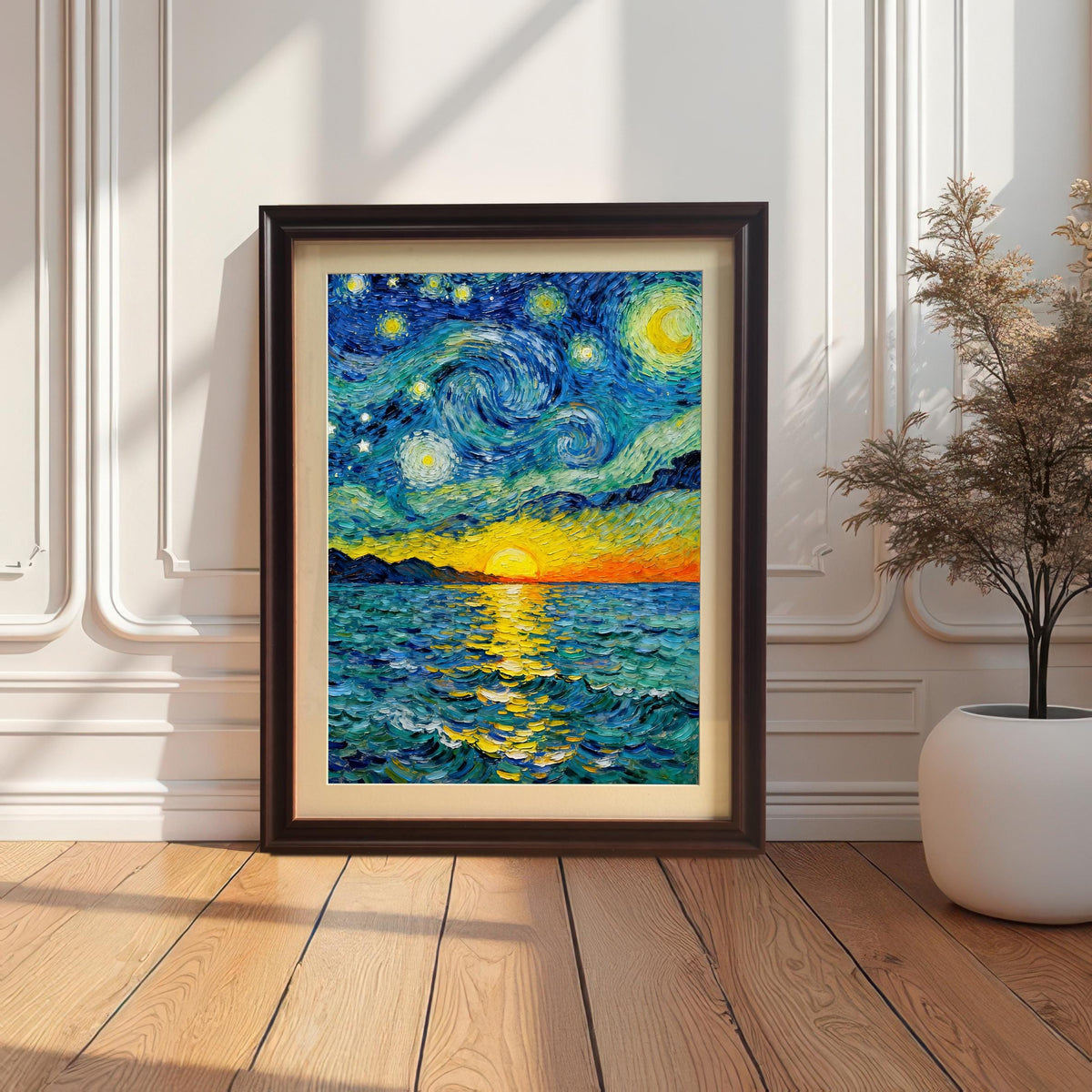 Van Gogh style art print of a starry night over a sunset sea displayed in a dark brown/coffee frame with a cream mount/mat. The framed print is leaning against a white decorative wall on a light wood floor next to a large dried floral arrangement.