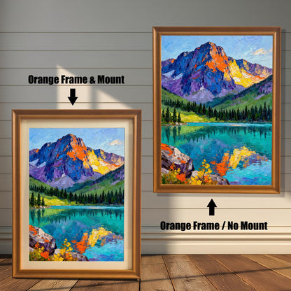 A vibrant oil painting print of a mountain reflected in a clear lake. The image compares two framing options: Orange Frame & Mount (light brown/gold frame with a cream border) and Orange Frame / No Mount.
