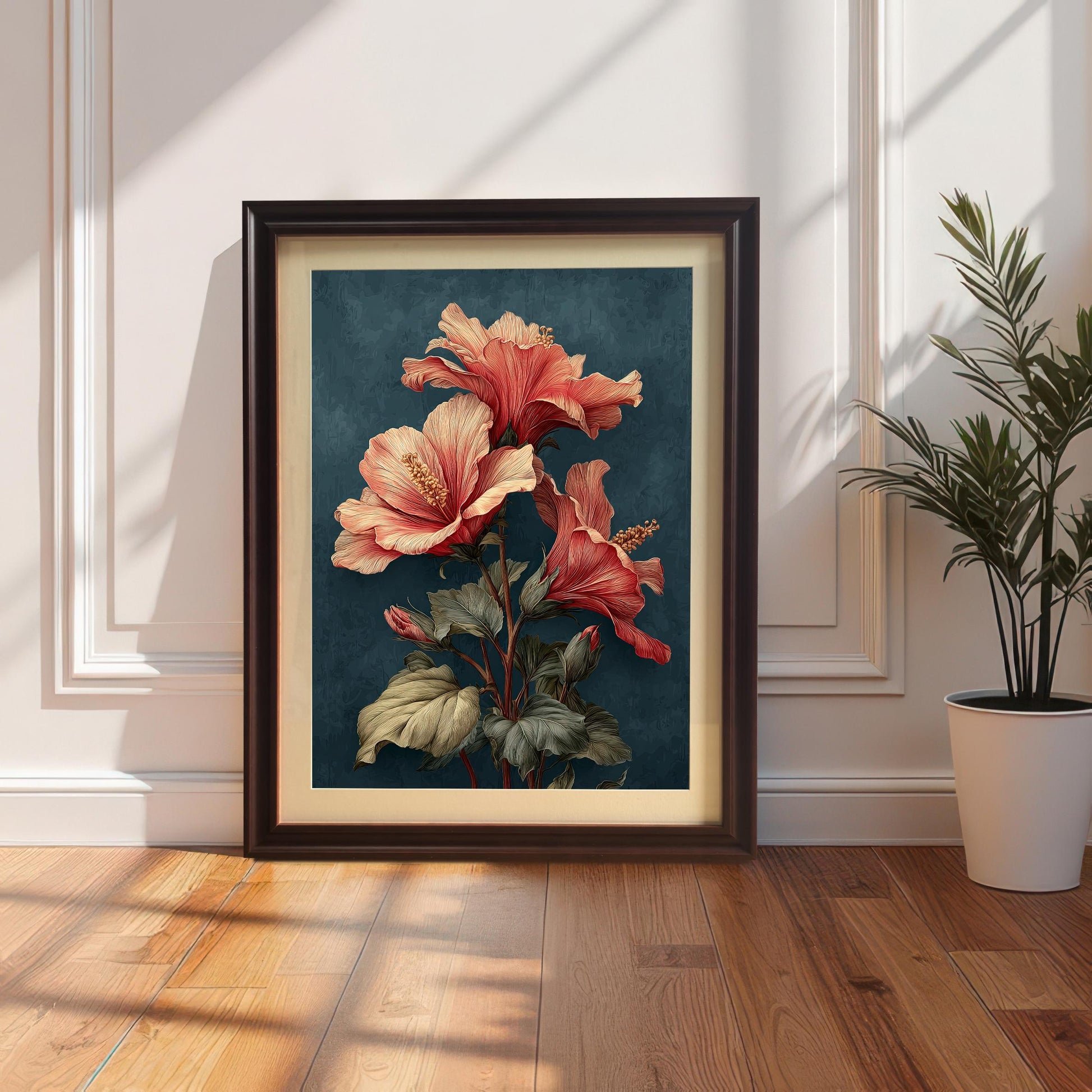 A vertically framed art print with a Coffee or Dark Brown wood frame and a mount (matting), leaning on a white wainscoted wall next to a houseplant. The art features a bold, vintage-style illustration of coral hibiscus flowers on a deep teal background