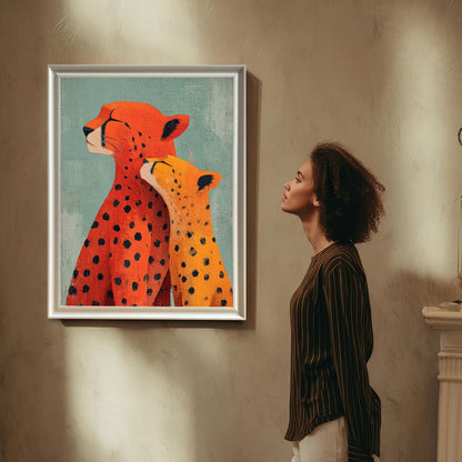 A woman with curly hair is standing and looking up at the framed 'Cheetah Love' art print, which is hanging on a textured beige wall. The art is displayed in a thin White/Silver Frame with a mount.