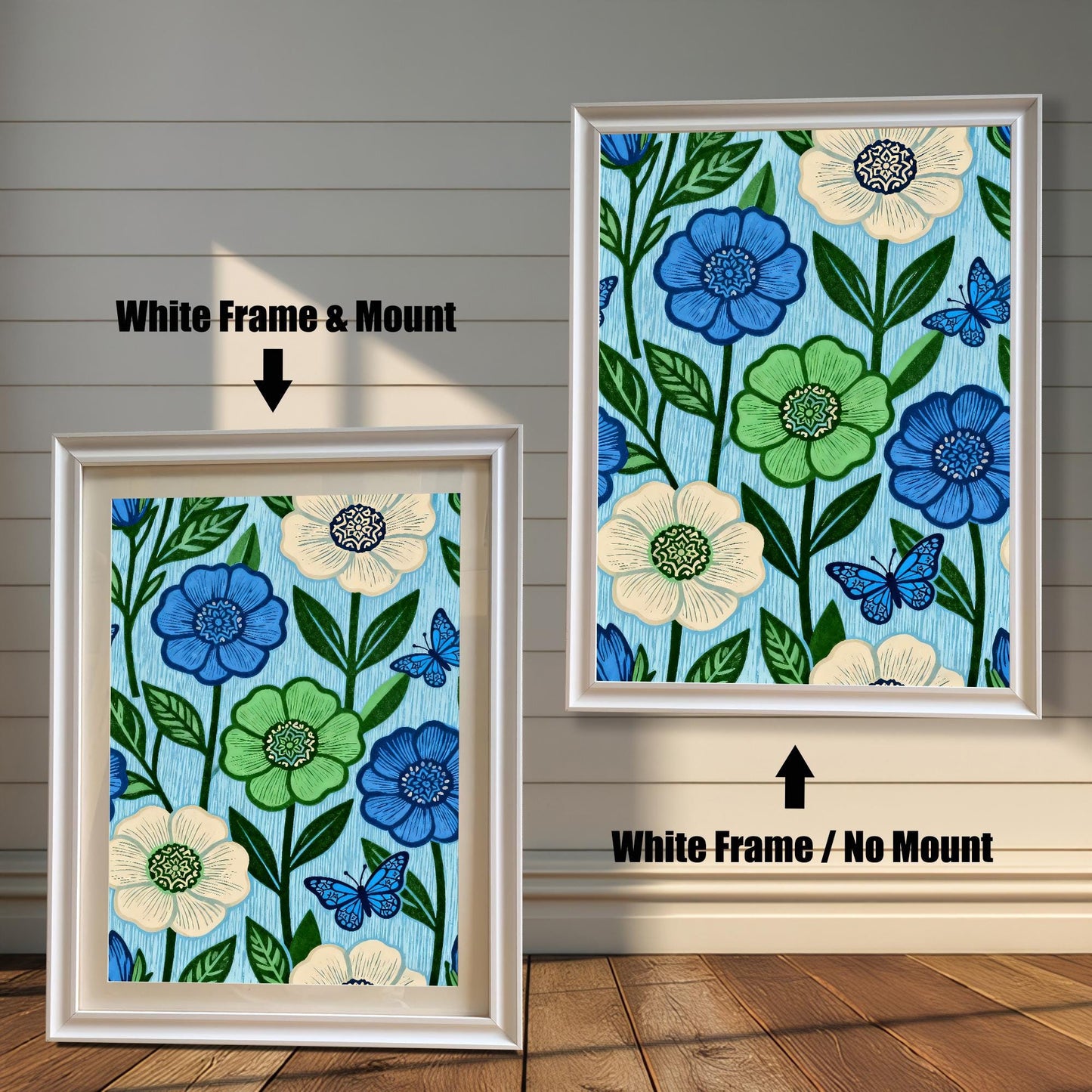 Comparison image showing a White framed art print with a light-colored mount (mat) on the left, and a White framed art print without a mount on the right. Both prints feature a repeating pattern of blue, green, and cream flowers with blue butterflies on a light blue, wood-grain textured background.