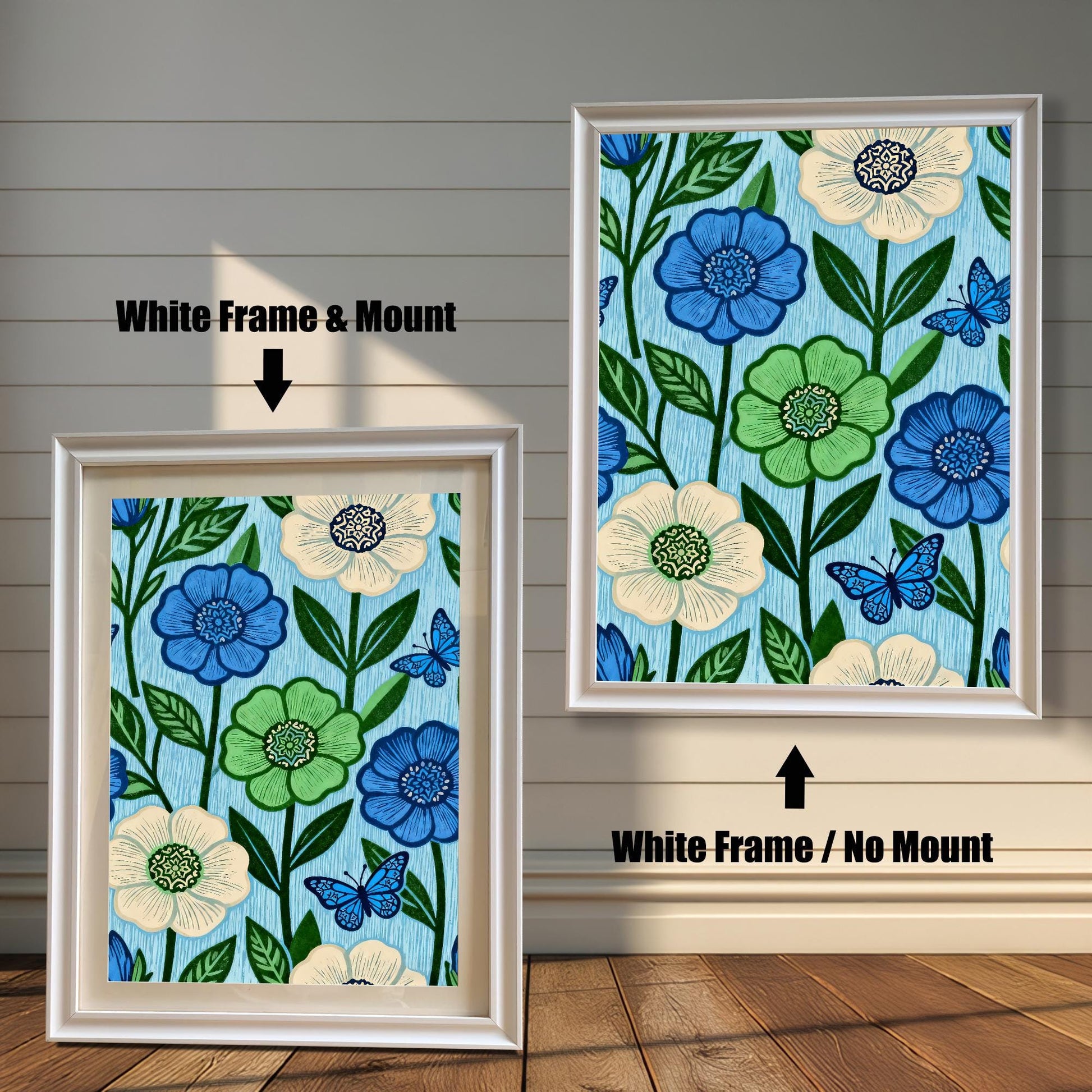 Comparison image showing a White framed art print with a light-colored mount (mat) on the left, and a White framed art print without a mount on the right. Both prints feature a repeating pattern of blue, green, and cream flowers with blue butterflies on a light blue, wood-grain textured background.