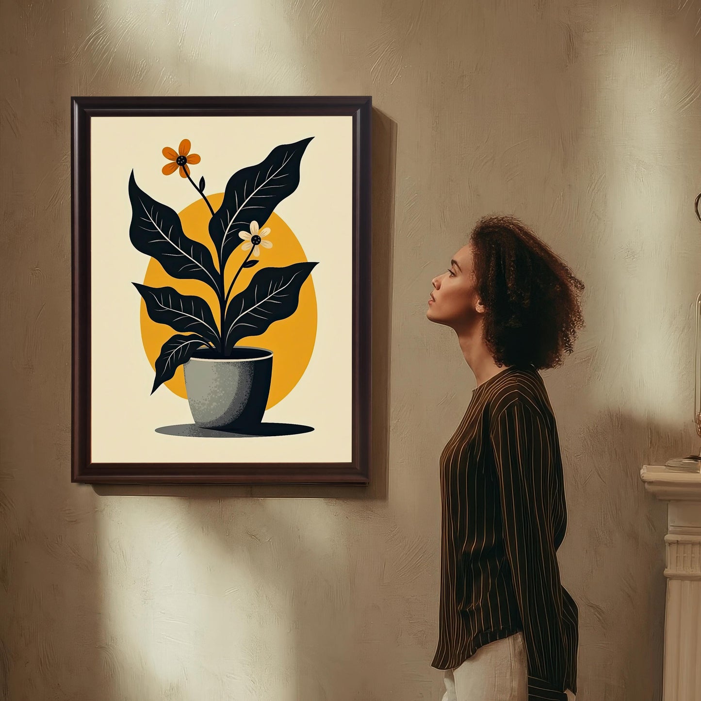 Mock-up of the abstract potted plant art print in a Coffee-colored (dark brown) wood frame, hanging on a textured wall. A woman in a striped shirt stands beside it, looking up at the artwork.
