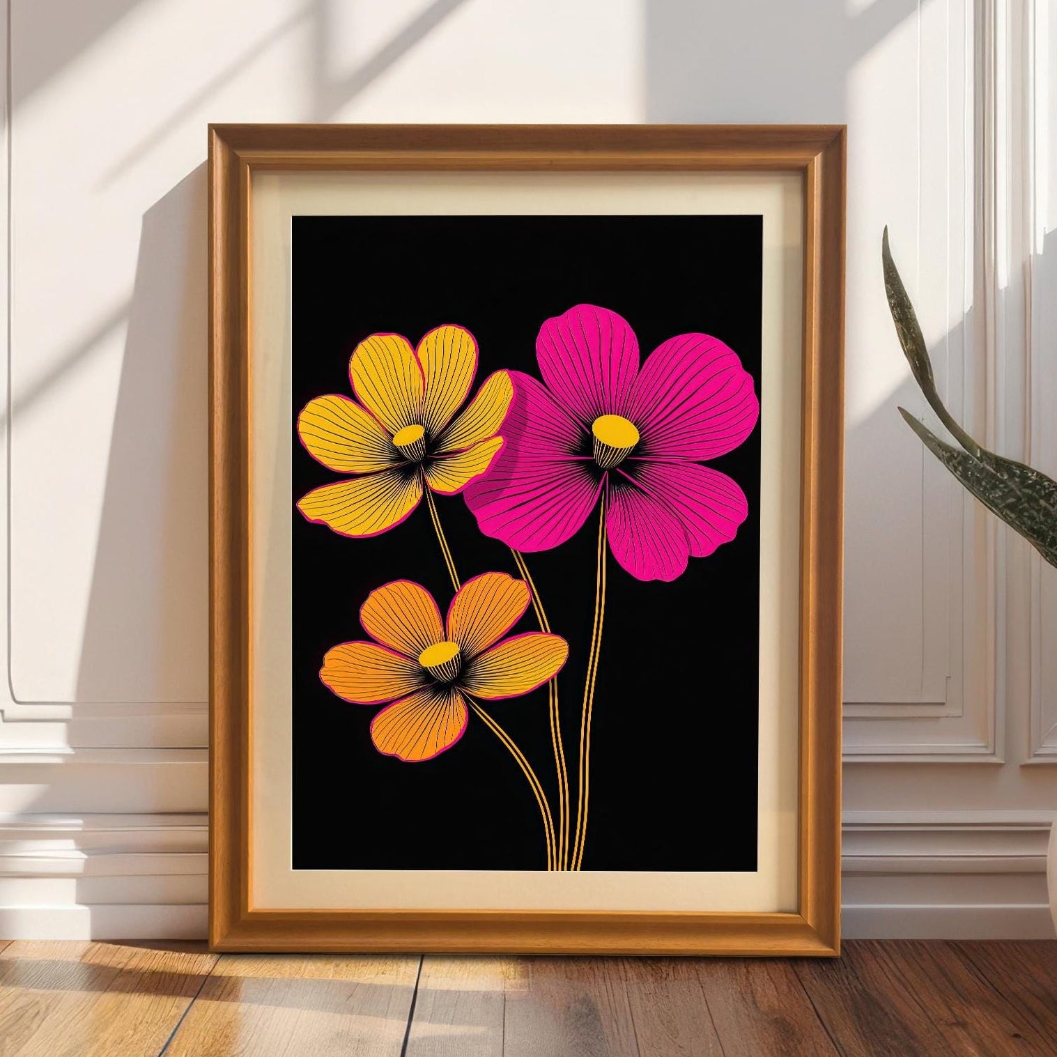 Styled image of the neon floral print in an Orange/Gold frame, propped on a wooden floor against a white panelled wall. The bright art contrasts with the neutral background.