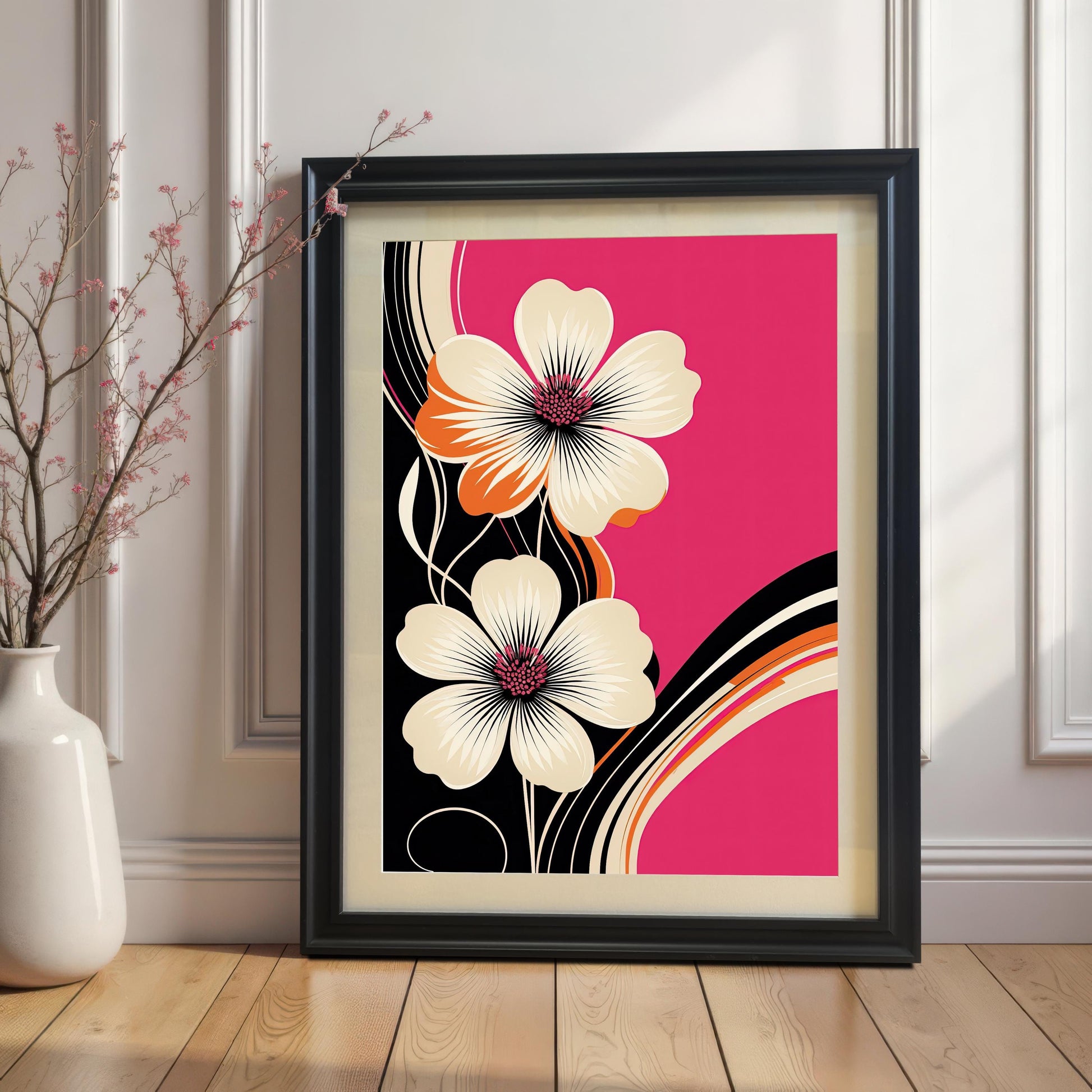 Styled image of the Black framed abstract floral art print with a mount/mat, propped against a white panelled wall and wooden floor. The print features stylized ivory and orange flowers on a bold fuchsia pink background.