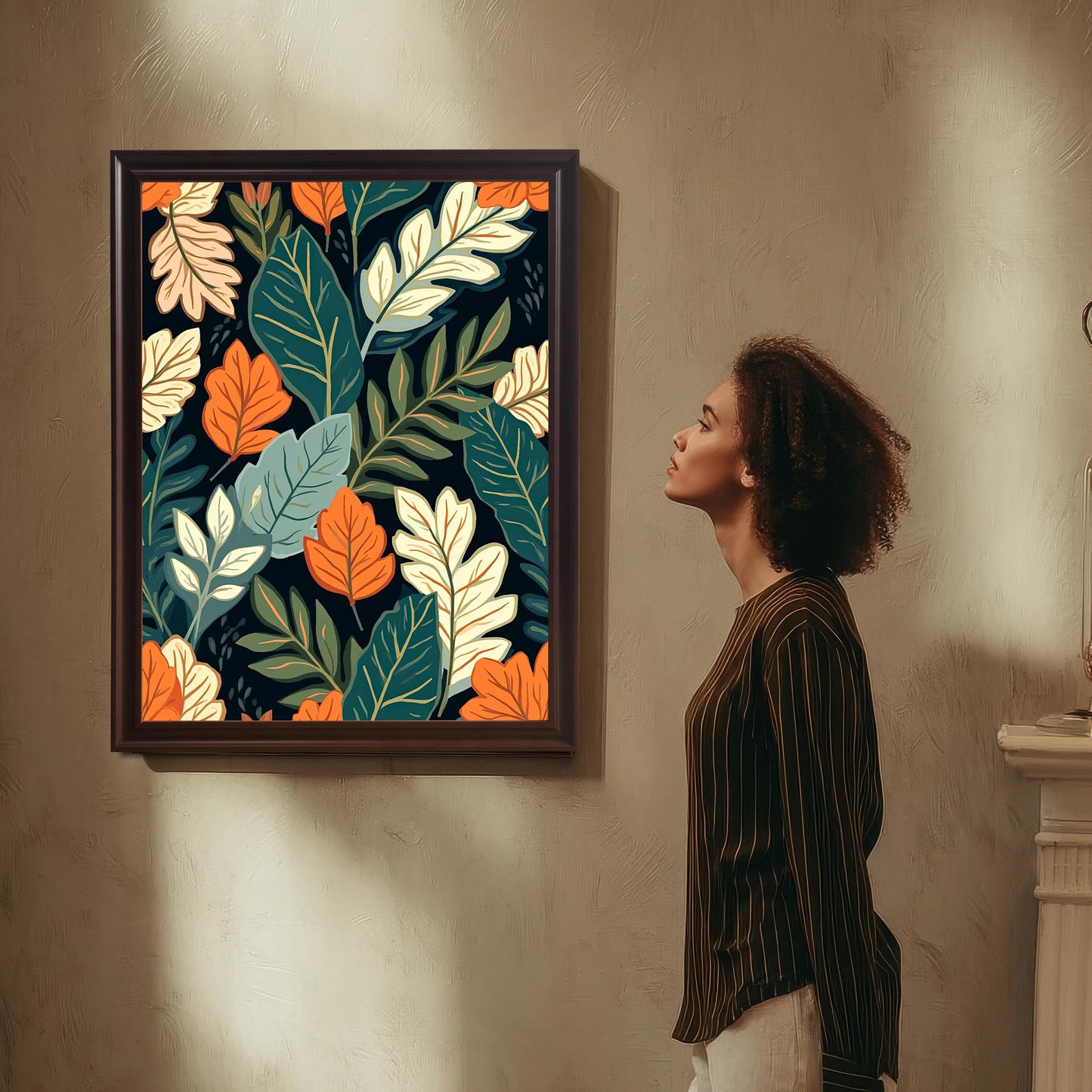 A woman with curly hair looks up at the dark botanical art print hanging in a Coffee/Dark Wood Frame on a beige wall, showcasing the print in a gallery-style setting.
