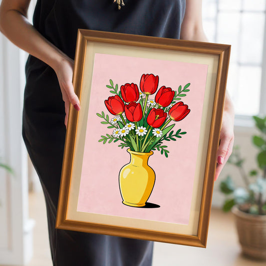 A person in a black dress holds a medium-sized print of the red tulips in a gold/orange wood frame, showing the product held in a home setting for a close-up on the frame and print quality.