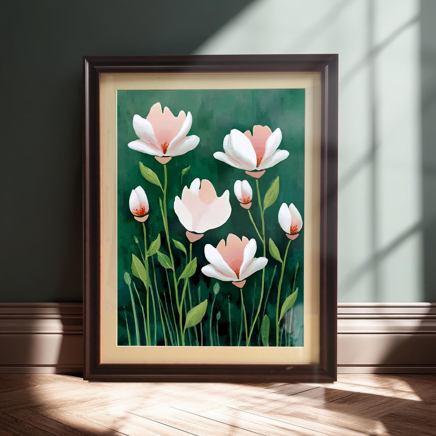 The abstract floral print, which features pink and white flowers on a dark green background, is in a dark brown (Coffee) frame and is leaning on a baseboard against a dark teal wall, highlighted by a beam of sunlight.