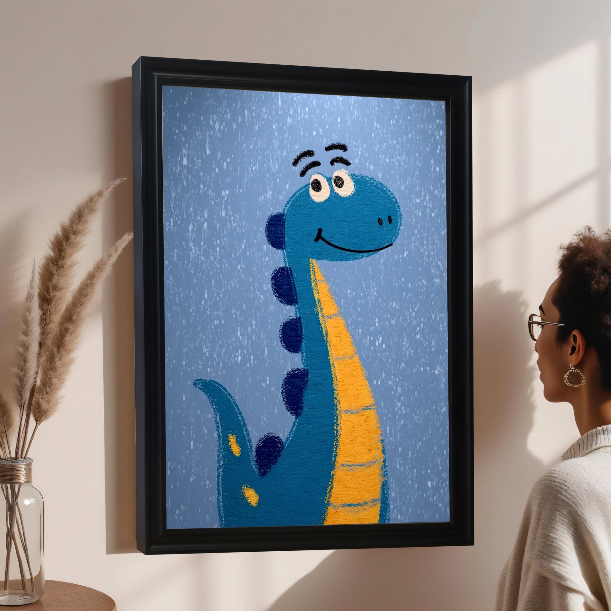 Lifestyle photo of the framed dinosaur art print in a black frame hanging on a light wall. A person wearing glasses looks at the art from the right side.