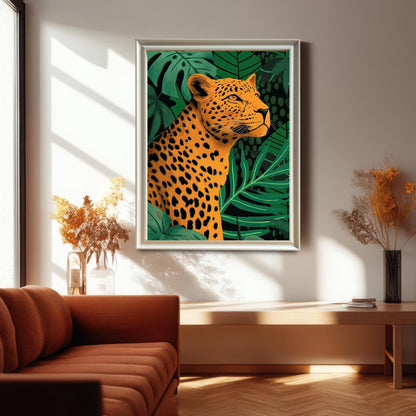 Lifestyle photo of the framed art print of a bold, spotted leopard surrounded by green jungle leaves, hanging on a bright wall above a low wooden console. The frame is white or light silver. A rust-orange sofa is visible on the left.