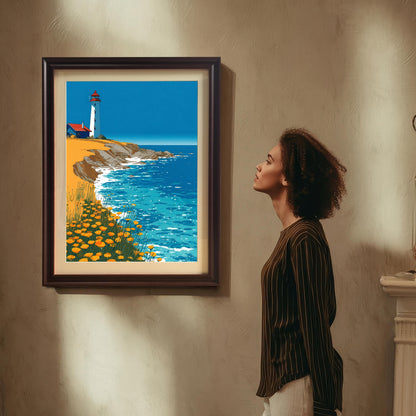 A stylized print of a lighthouse on a sunny, rocky coast with orange flowers, framed in a Coffee/Dark Brown frame with a light-colored mat. The framed art is hanging on a textured wall, and a woman in a striped shirt is standing beside it, looking up at the print.