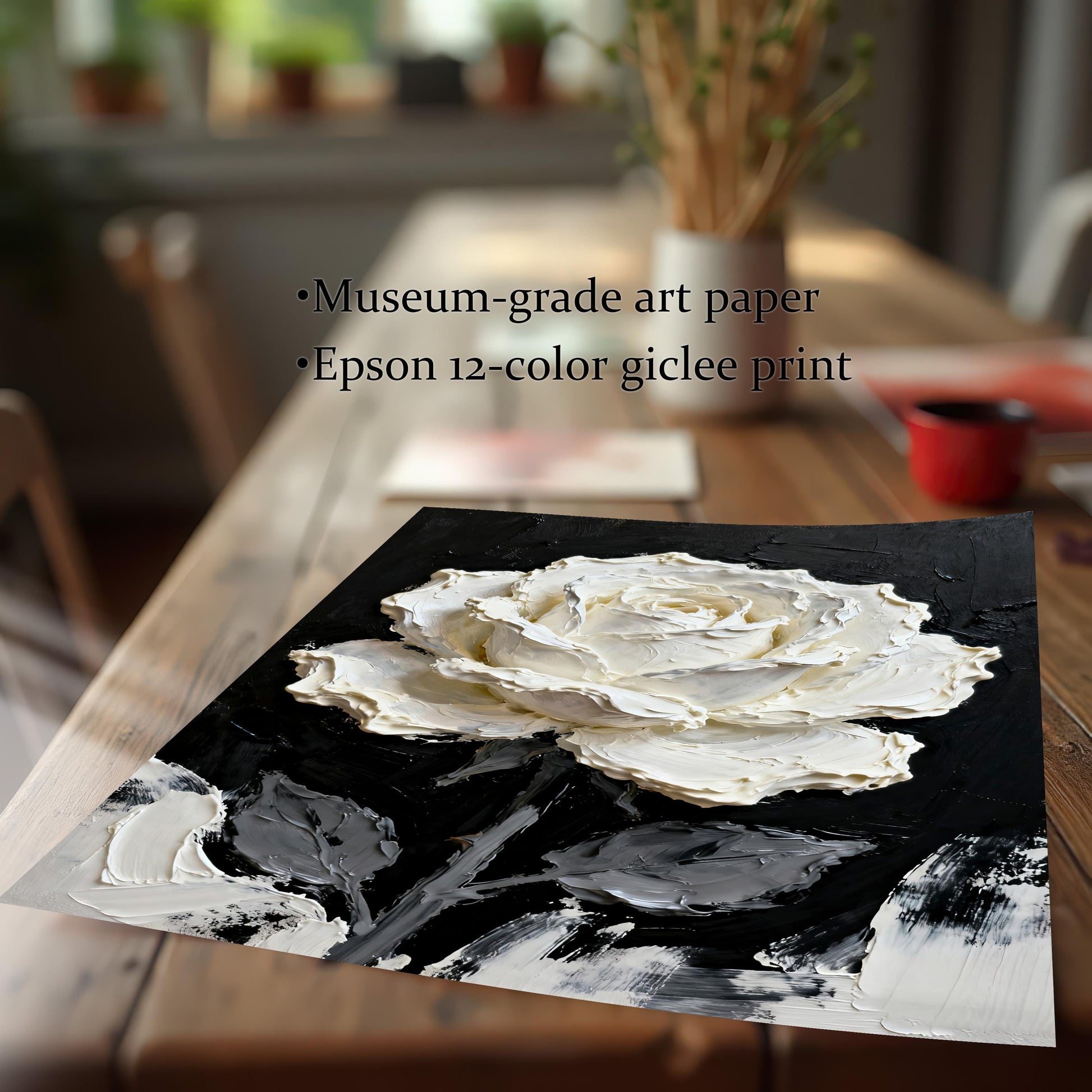 Close-up shot of the textured white rose art print displaying its quality on a wooden table. Text highlights the print material: ""Museum-grade art paper"" and ""Epson 12-color giclee print.""