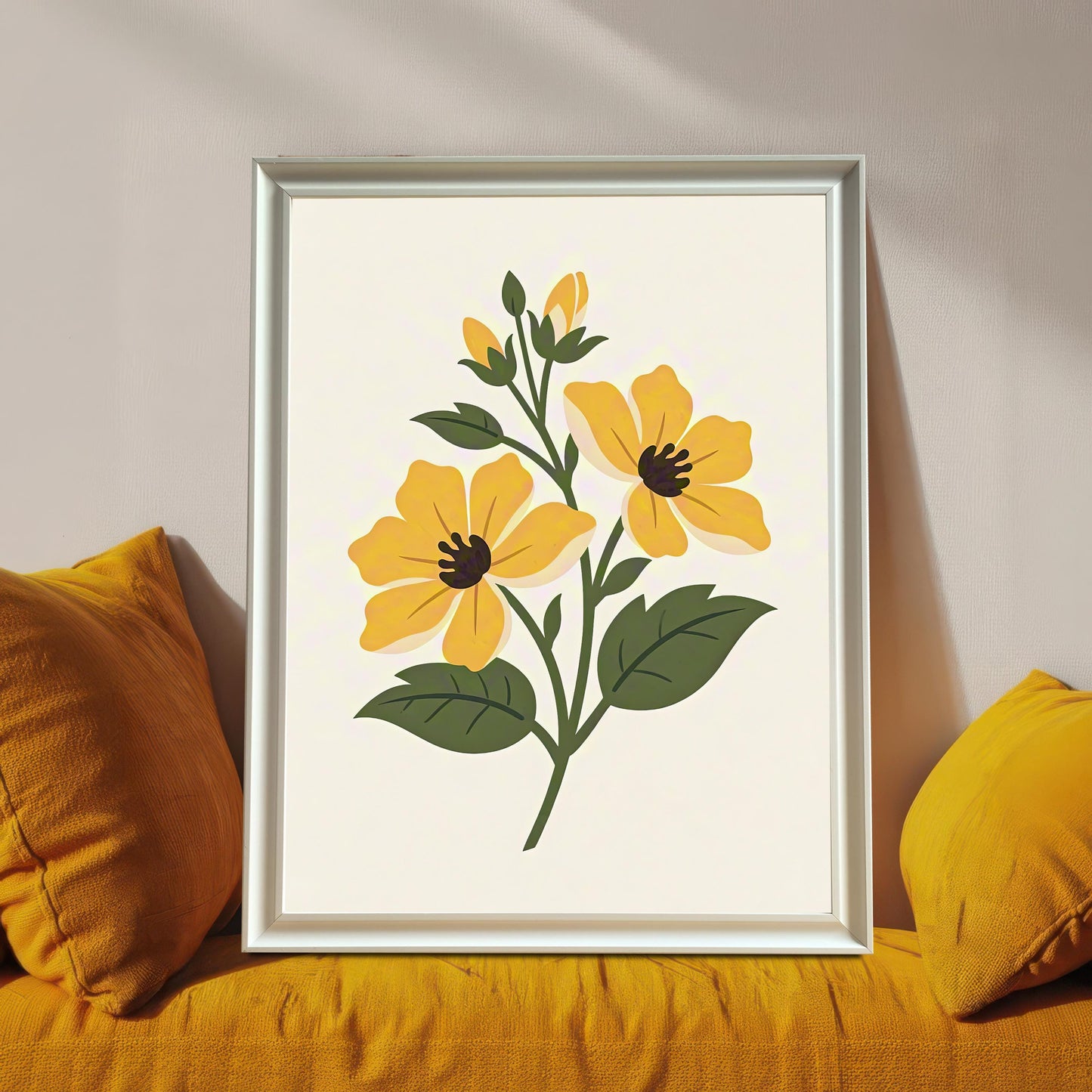A framed art print featuring two stylized yellow flowers with dark centers, dark green leaves, and buds, set against a cream background. The print is in a White Frame and is resting on a mustard-yellow sofa cushion, surrounded by matching pillows.