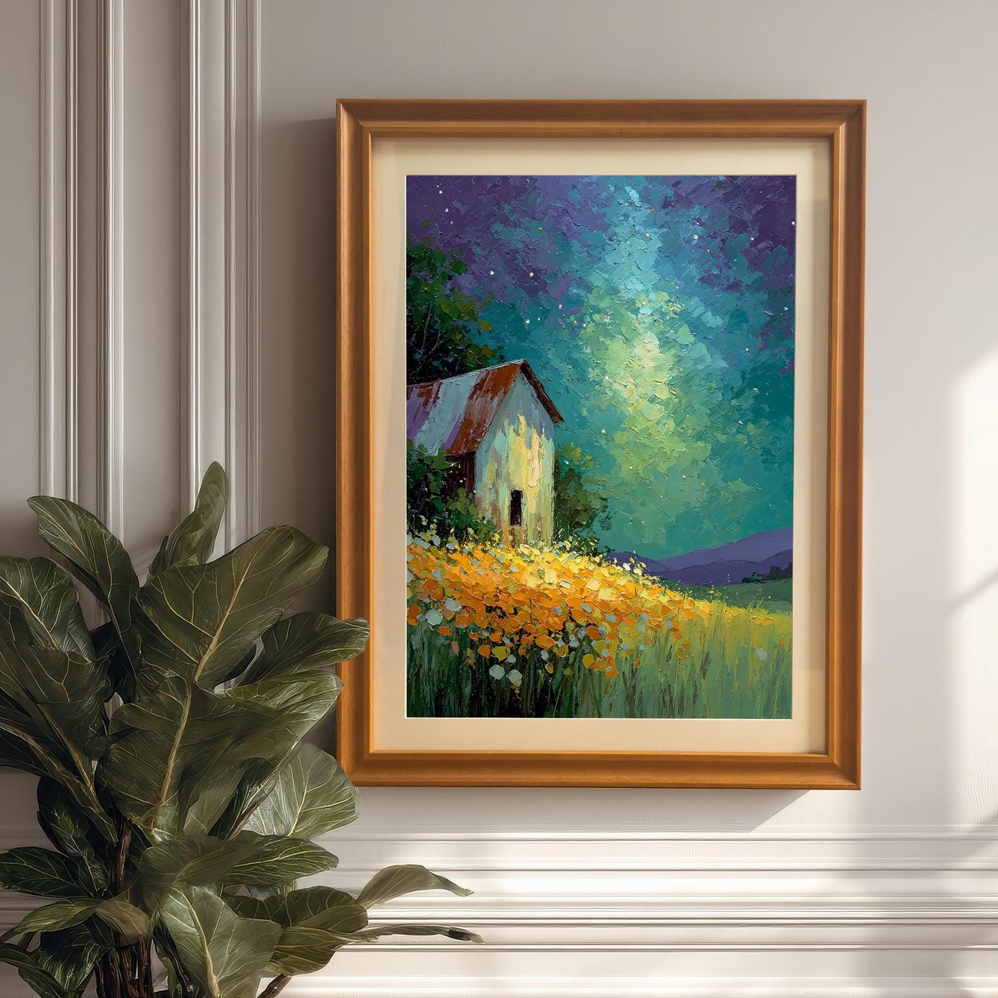 Impressionistic painting of a barn in a field of yellow flowers under a dramatic, colorful, starry night sky, framed in Orange wood with a mat, hanging next to a large plant.