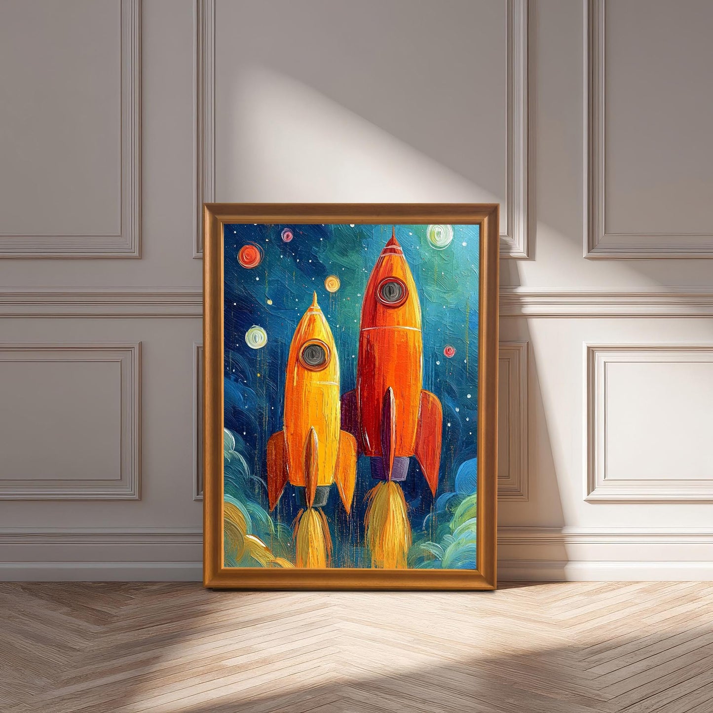 Oil painting of two orange and yellow rockets blasting off into a dark blue, starry sky, set in a gold-colored wooden frame, leaning against a white wainscot wall on a wooden floor.