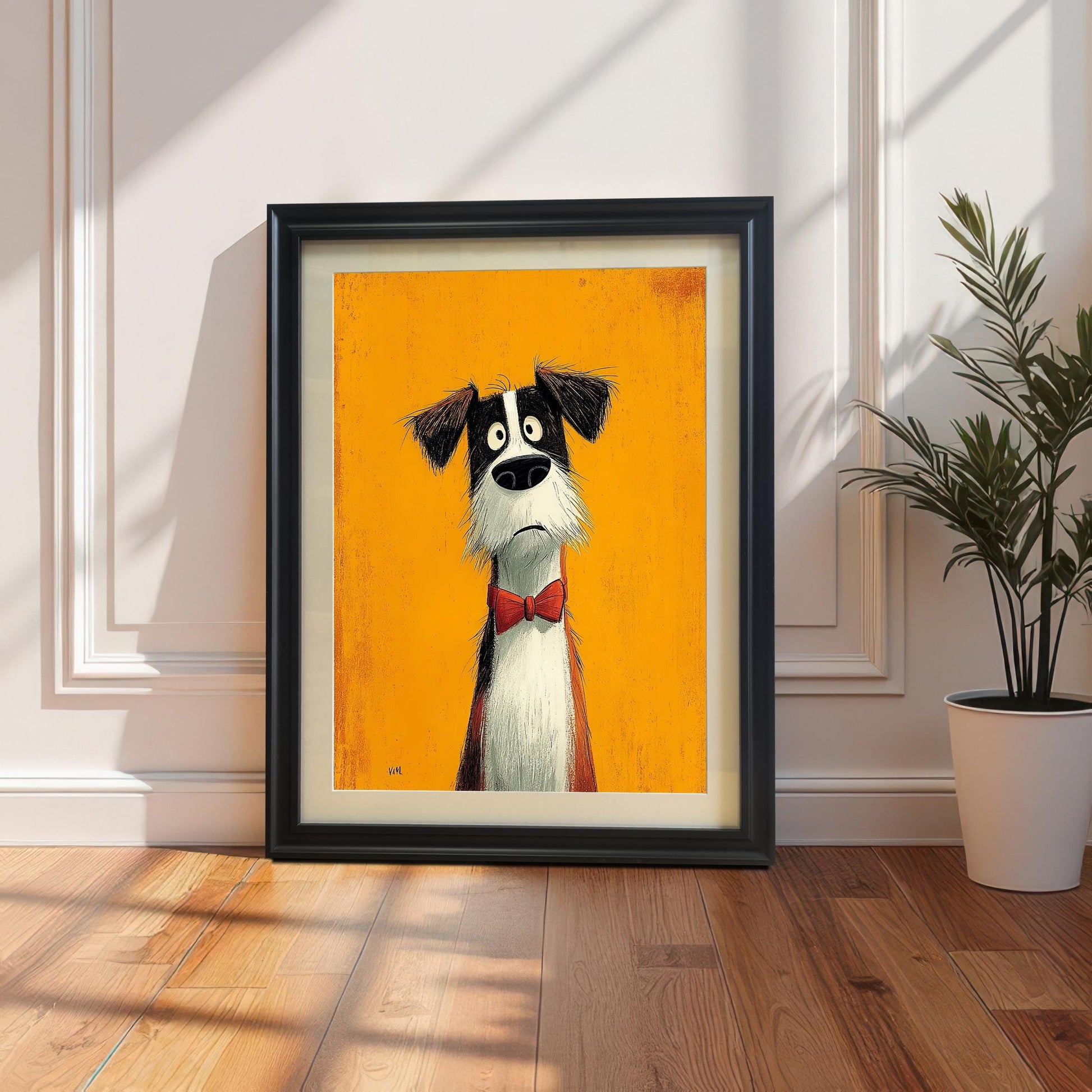 A framed print of the cartoon dog in a black frame with a mount, leaning on a wooden floor against a white paneled wall beside a potted plant.