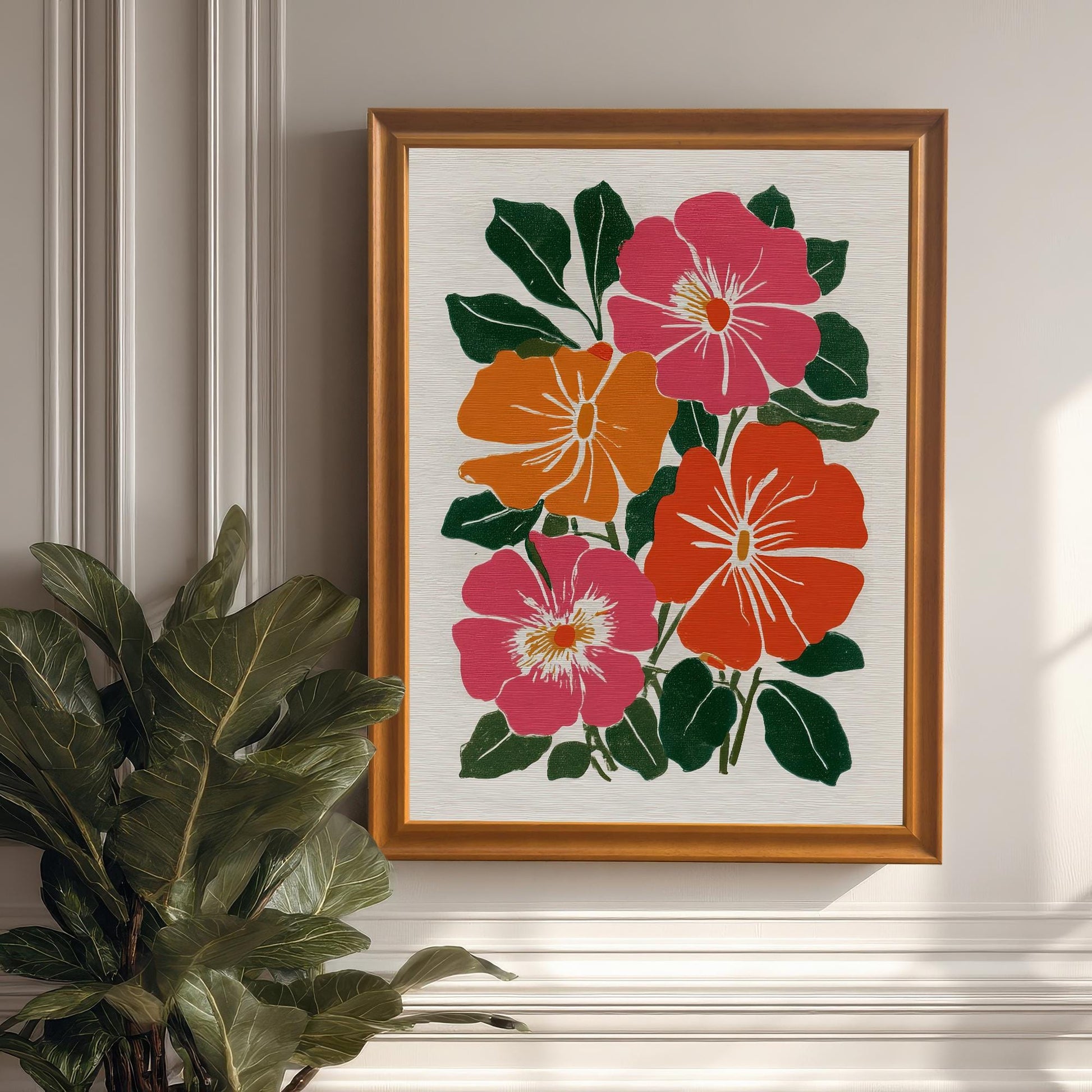 A framed botanical print with a reddish-brown frame hanging on a white wall next to a large potted plant.