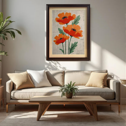 Lifestyle photo showing the framed artwork of three stylized orange poppies on a textured cream background, hanging on a white wall above a beige sofa and a wooden coffee table. The frame is dark brown/Coffee and includes a visible light-colored mount (mat).