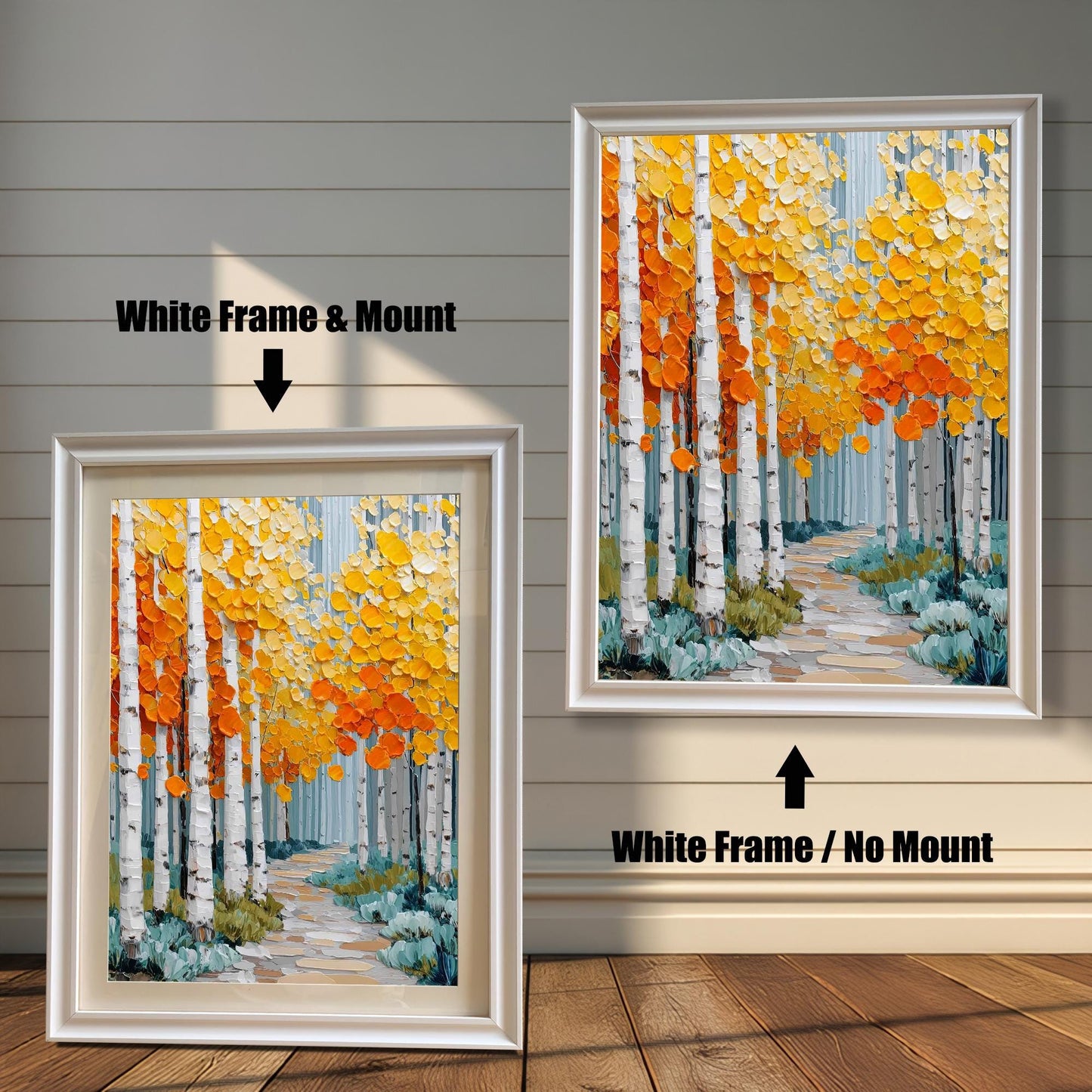 Two versions of the aspen forest print against a rustic wooden wall. The print is an impasto style showing white birch trees and colorful fall foliage. The left print has a white frame and a mount, while the right print has a white frame and no mount.