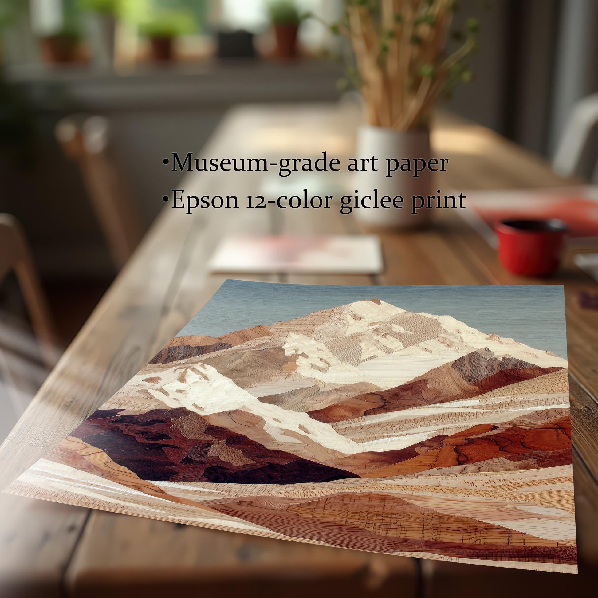 Close-up image of the corner of the mountain art print laid flat on a wooden table, emphasizing the texture and print quality. Text notes the use of Museum-grade art paper and an Epson 12-color giclee print.