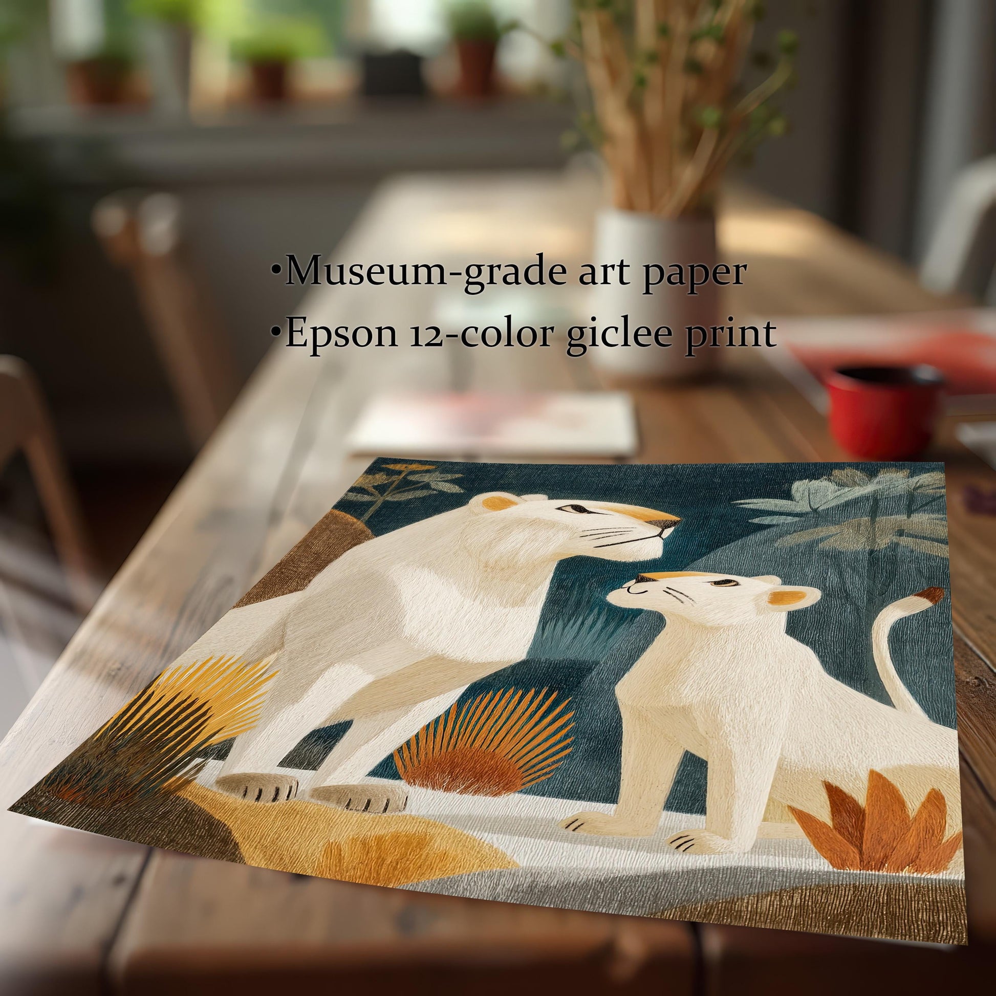 The unframed print of the white lioness and cub, showing the detailed embroidery texture, lying on a wooden table. Text highlights the print quality: "Museum-grade art paper" and "Epson 12-color giclee print."