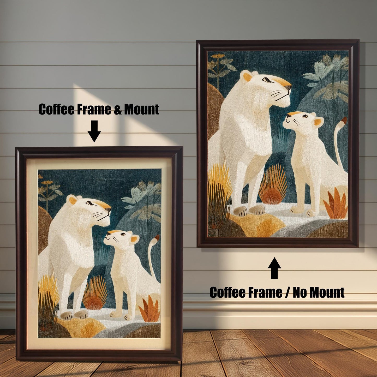 Two versions of the framed lion print against a distressed white wood background: one on the left in a Coffee Frame & Mount (with a light-colored border), and one on the right in a Coffee Frame / No Mount (without a border).