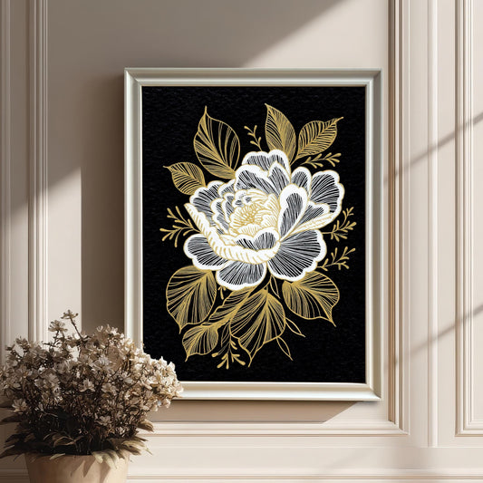 The floral print in a white frame, hanging on a white wainscoted wall next to a pot of dried flowers, with strong vertical shadows from a nearby window.