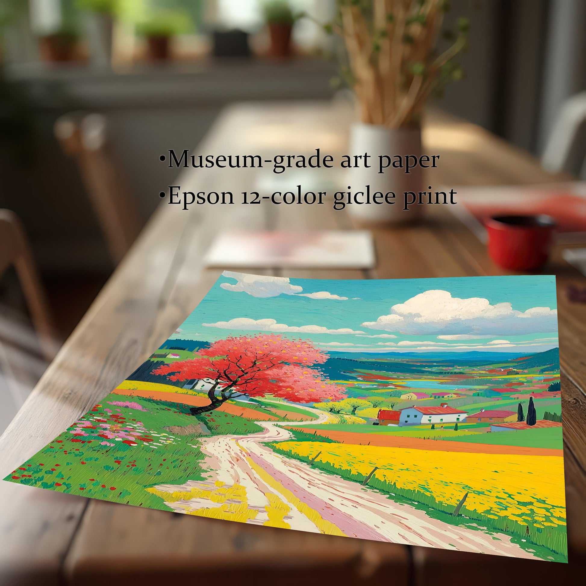 A close-up view of the unframed, colorful spring landscape art print lying on a wooden table, emphasizing the texture and print quality. Text describes it as Museum-grade art paper and an Epson 12-color giclee print.