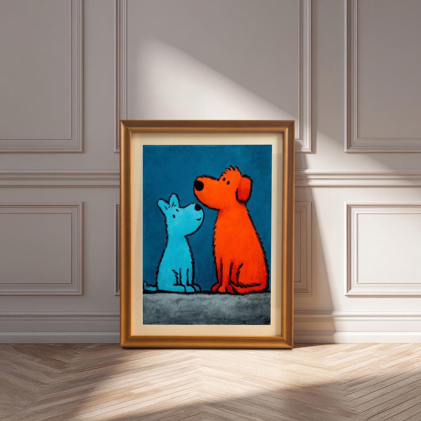 The framed pop art print of the blue and orange dogs with an Orange Frame (or Gold Tone Frame) and a mount (matting) leaning against a decorative paneled wall on a wood floor, with strong natural sunlight casting shadows.