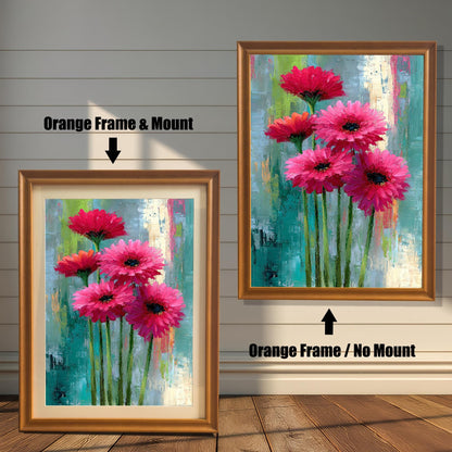 Abstract floral painting of bright pink flowers in two options: an Orange Frame & Mount (with a light border/mat) on the left, and an Orange Frame / No Mount (full print to the frame edge) on the right. Both hang on a wood-paneled wall.