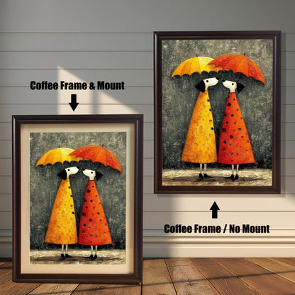 Whimsical umbrella couple art print shown in two variations with a Coffee (Dark Brown) Frame: on the left, with a Mount/Mat; on the right, with No Mount (full image). Both are against a light wood-paneled wall.