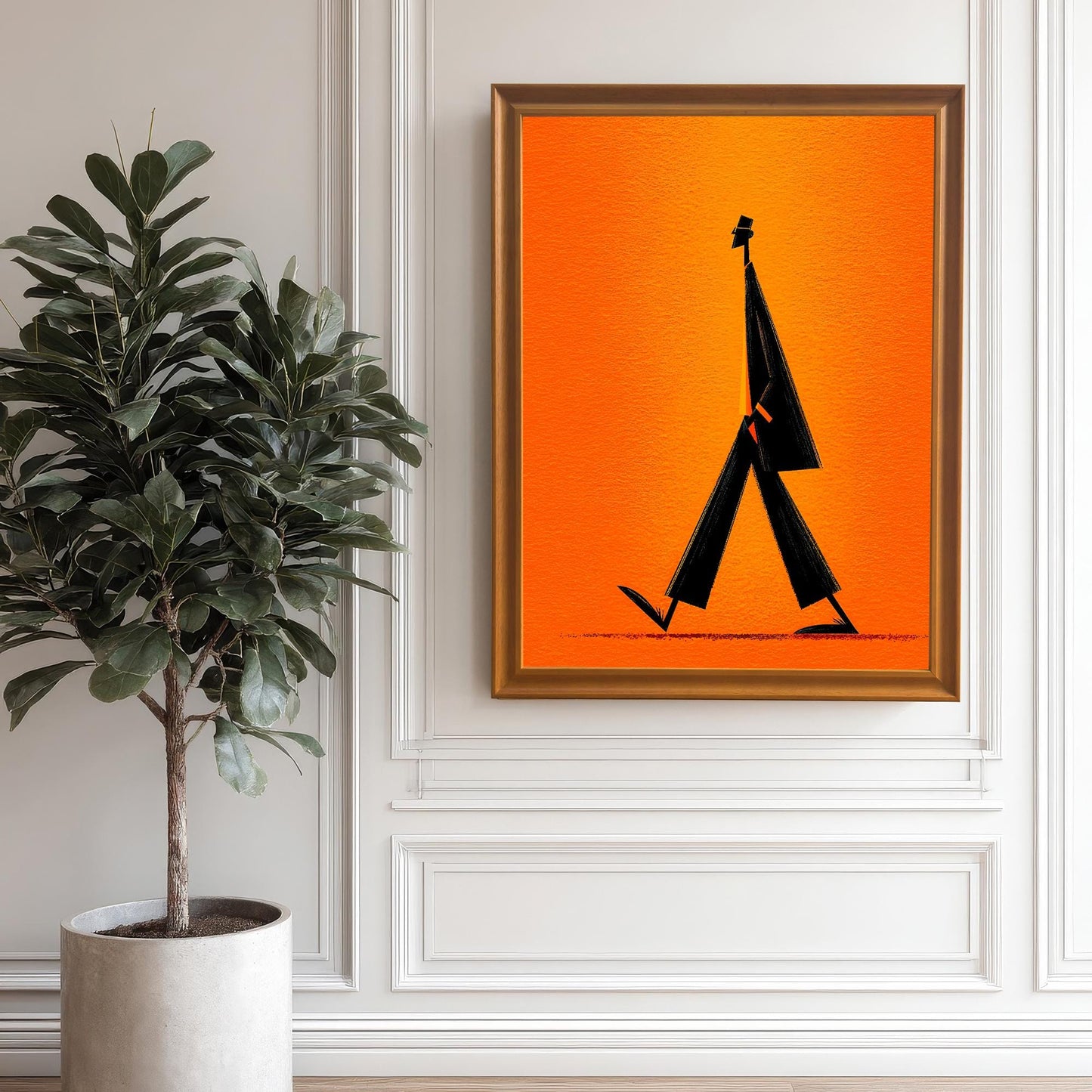 Minimalist walking figure art print framed in Orange/Gold/Wood Tone and hanging on a white wall with wainscoting paneling. A large indoor plant is positioned to the left.