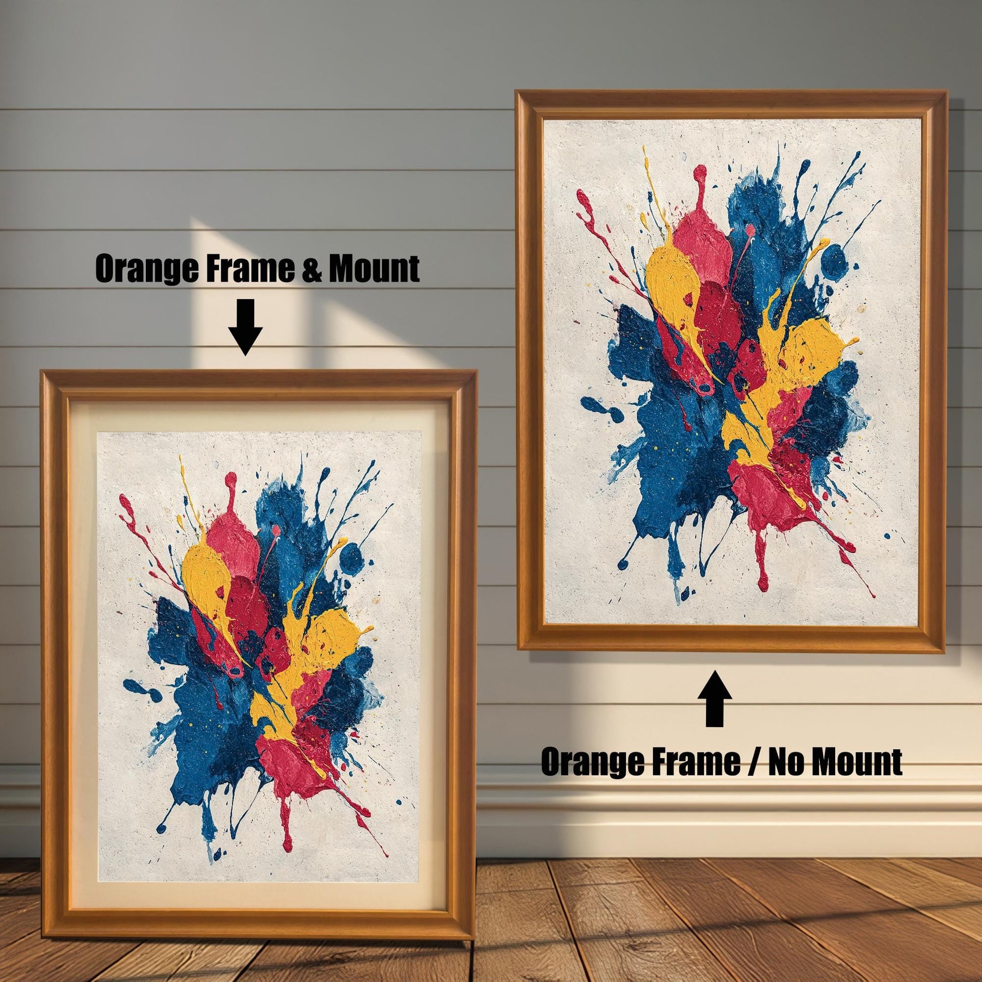 Abstract paint splatter art print shown in two variations with an Orange Frame: on the left, with a Mount/Mat; on the right, with No Mount (full image). Both are against a light wood-paneled wall.