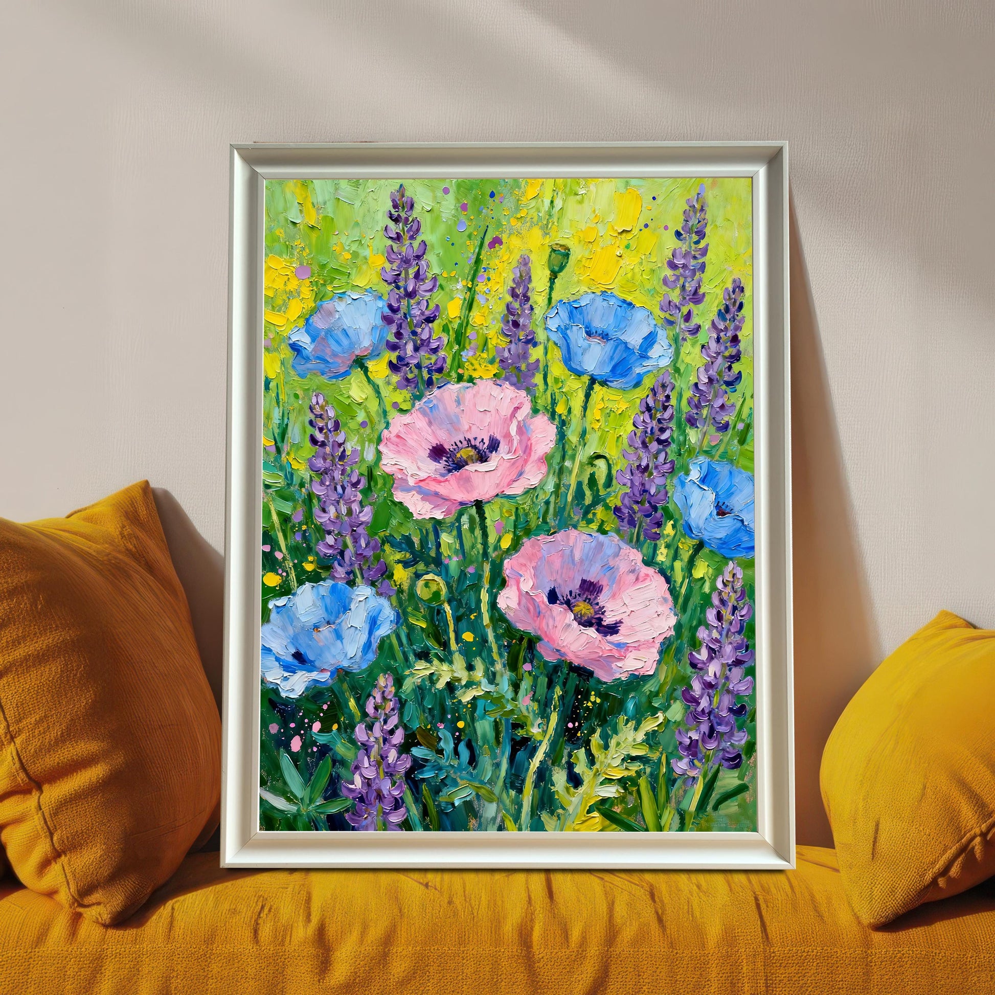 Styled photo of the poppy and lavender floral art print in a White frame, resting on a bright yellow couch or cushions.