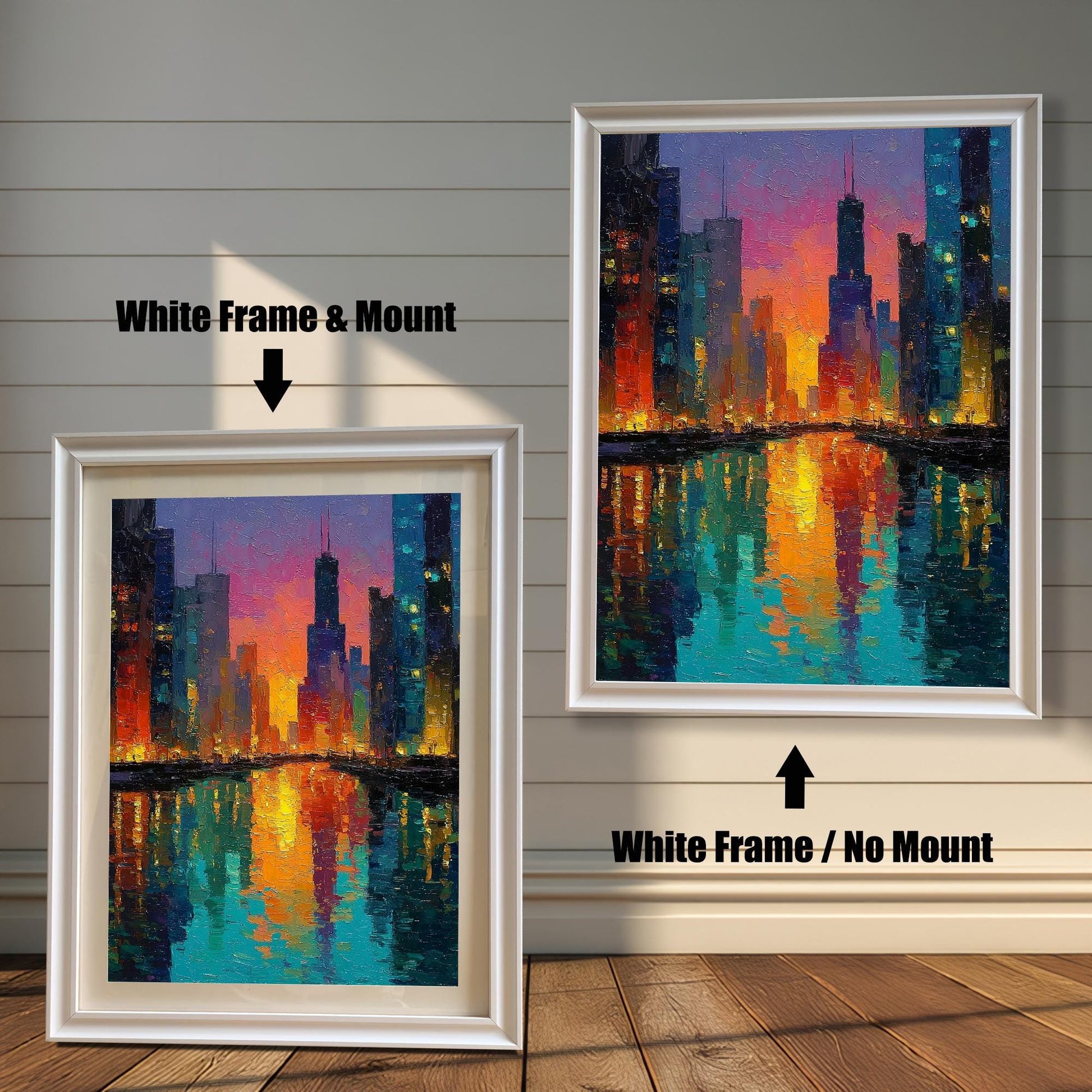 Product image comparing two options: a White Frame & Mount (with a white mat) and a White Frame / No Mount (without a mat) for the colorful Chicago skyline art print. They are leaning on a wood floor against a white, shiplap wall background.