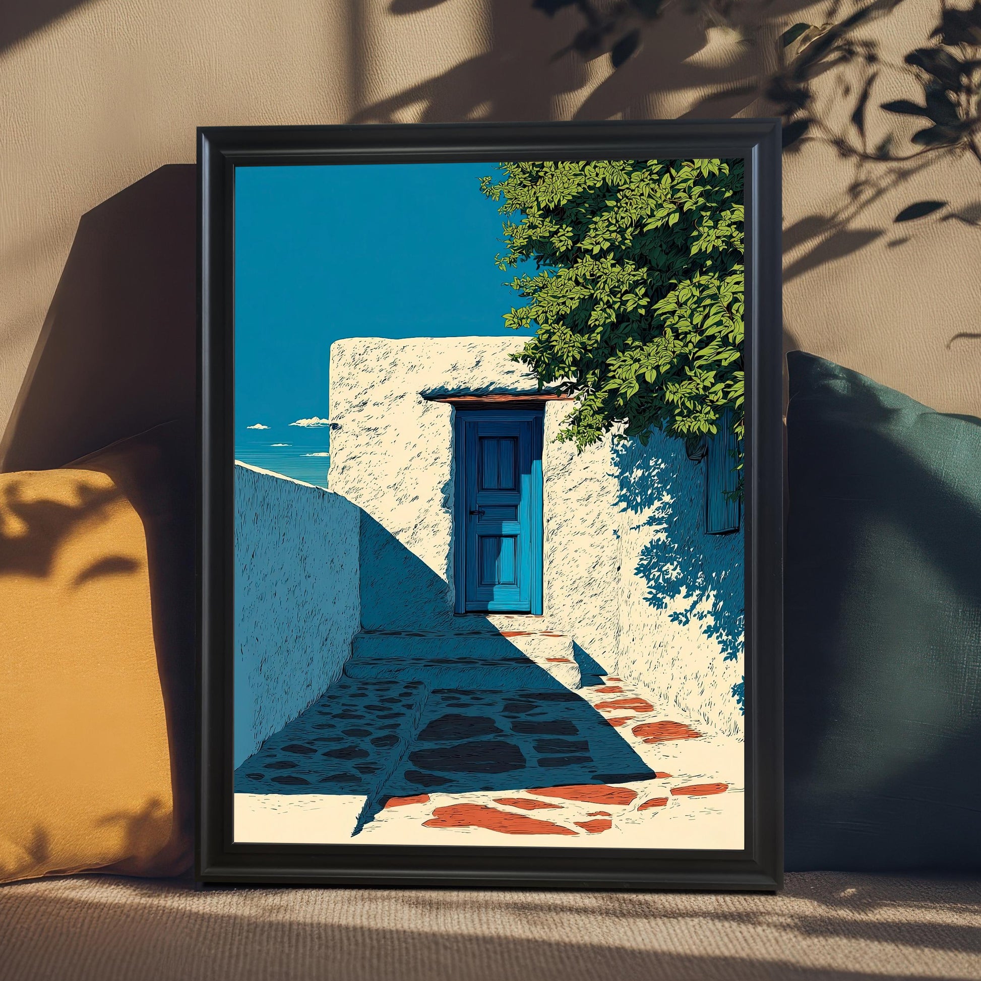 A close-up of the art print in a Black Wood Frame displayed on a couch or cushioned seat, flanked by a mustard-yellow pillow and a teal pillow. Shadows of leaves fall over the art and seating area.