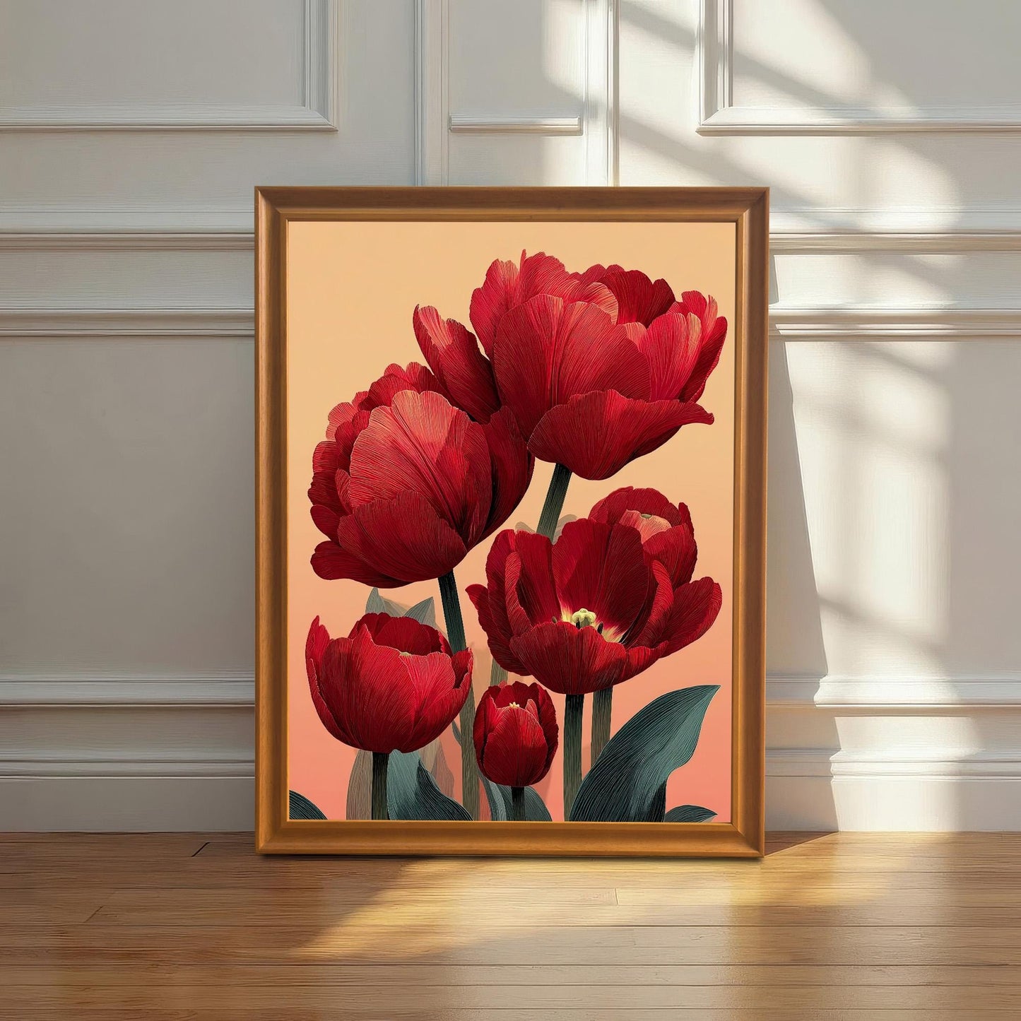 A framed print of the red tulip art in a Wood/Orange frame leaning against a white wainscoting wall on a wooden floor, with dramatic sunlight casting a shadow.