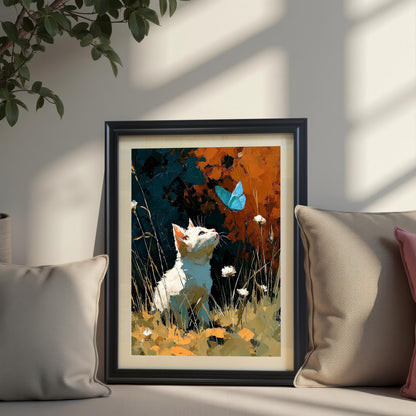 The art print featuring a white cat and blue butterfly, displayed in a Black wood frame, placed on a couch or window seat and leaning against the wall, flanked by two neutral-colored throw pillows.