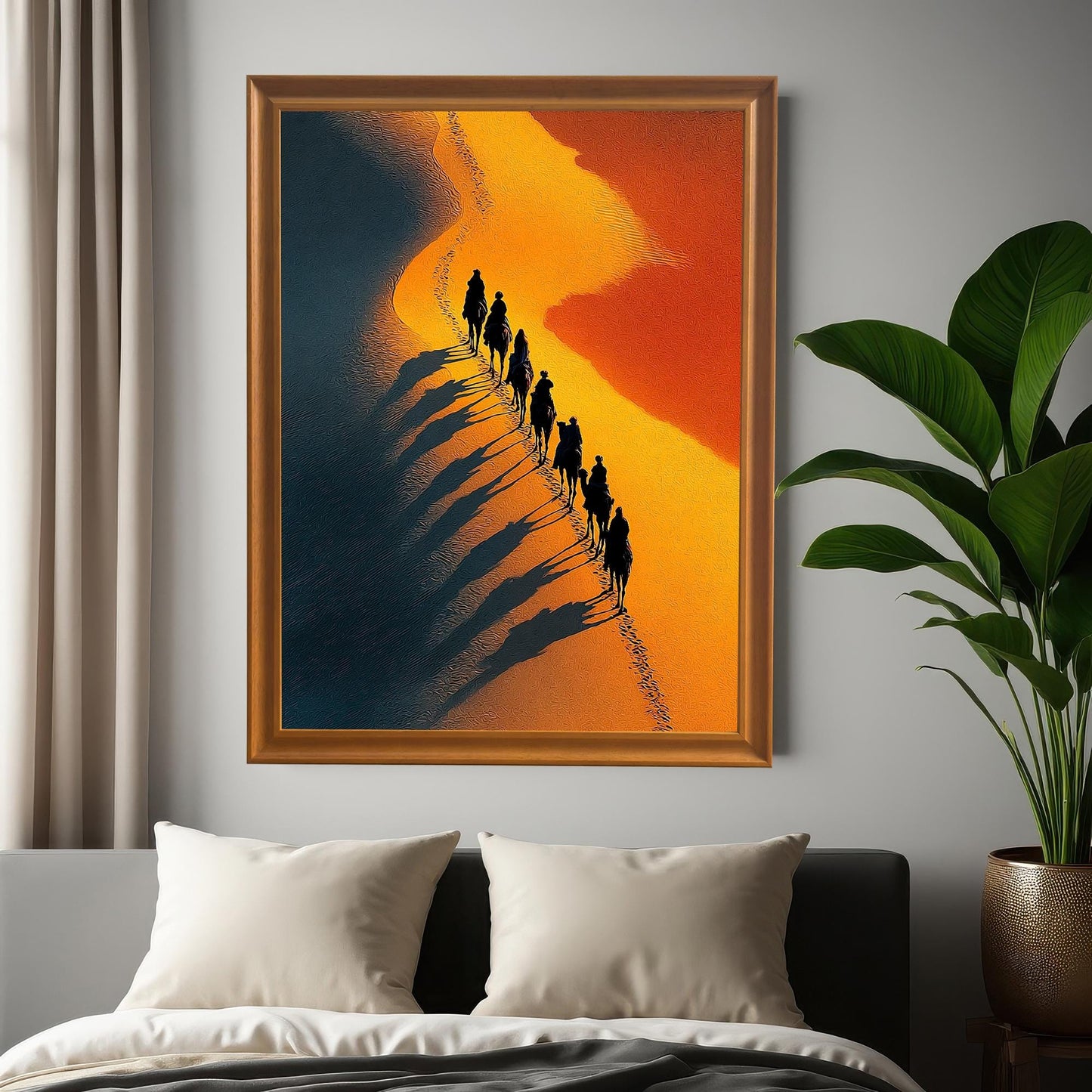 Photo of the framed desert art print (Orange Frame / No Mount) hung on a gray wall above a bed, next to a window and a large potted plant, showing the art in a bedroom setting.