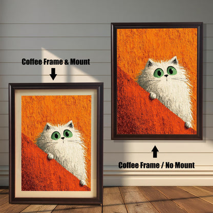 Two framed prints of the white cat on a rustic wood-paneled floor and wall. The left shows a Coffee Frame & Mount (matting), and the right shows a Coffee Frame / No Mount.
