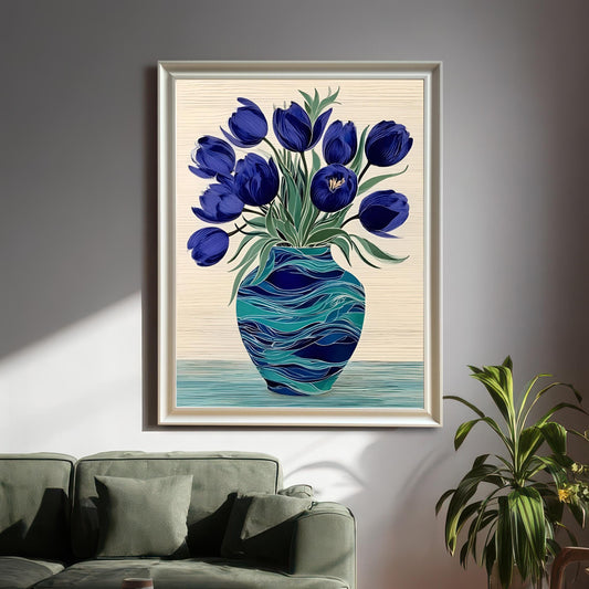 Large framed print of blue tulips hanging on a light grey wall in a living room setting with a green sofa and plant. The frame is White-colored wood.