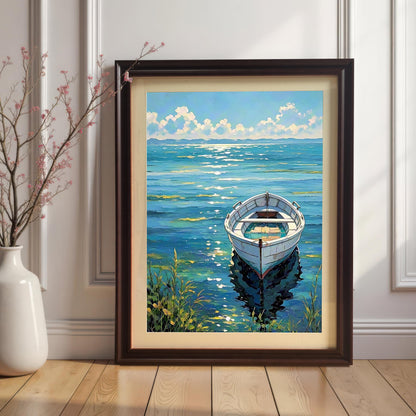 The boat art print in a Coffee-colored frame with a mat (mount) leaning on a light wooden floor and white baseboard, next to a white vase with pink-flowered branches.