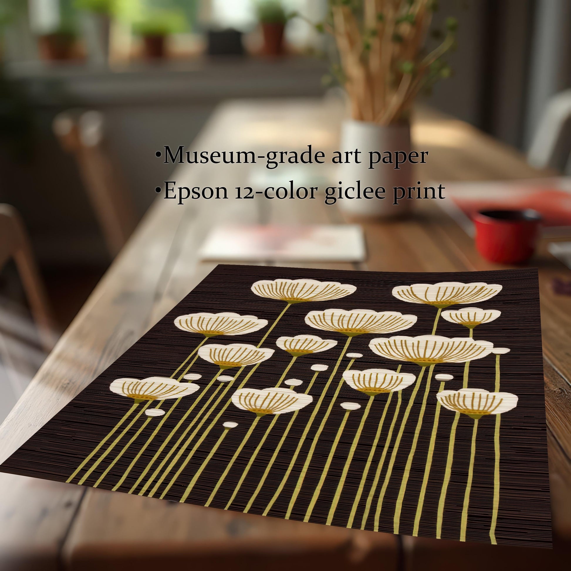 Close-up of the abstract white and gold flower art print laying on a wood table, highlighting details and text: ""Museum-grade art paper"" and ""Epson 12-color giclee print"".